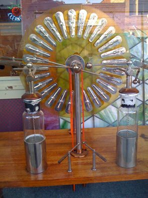 Electrostatic generator with glass and metal components.