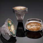 Three silver rings with large stones.