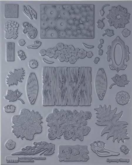 Various decorative rubber stamps on gray background.
