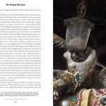 Text and ornate object with jewels.