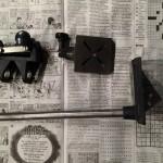 Metal tools on a newspaper background.