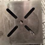 Metal plate with slotted openings.