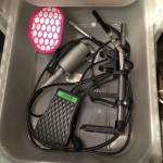 Power tools and accessories in storage bin.