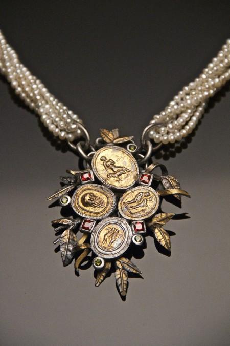 Ornate necklace with pearls and gold medallions.