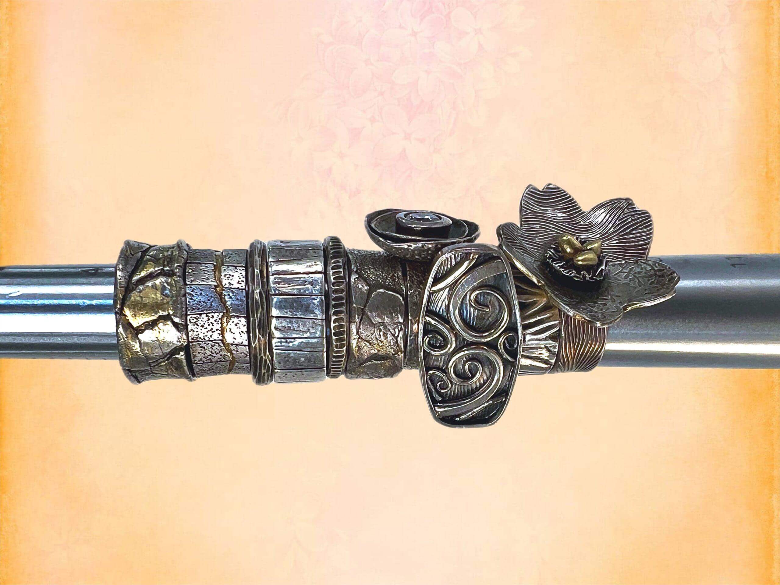 Decorative metal rings on a metal rod.
